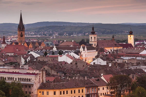 Romania, Transylvania, Sibiu, elevated city view, dusk