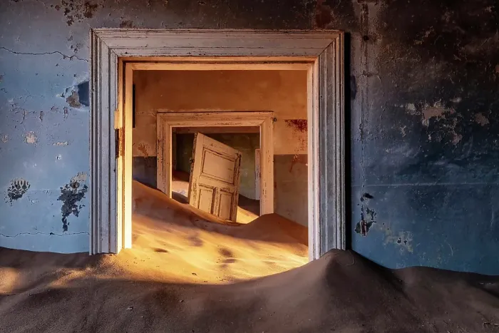 Framed Print : Rooms full of sand and suspended door in abandoned diamond mining town of Kolmanskop, Luderitz, Namib Desert, Namibia Framed Print : Rooms full of sand and suspended door in abandoned diamond mining town of Kolmanskop, Luderitz, Namib Desert, Namibia