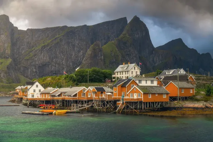 Framed Print : The rorbuer of Sakrisoy, a small village in the souther part of the Lofoten Islands, during a stormy summer afternoon. Norway
