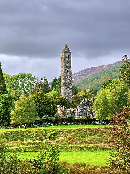 The Round Tower at sunset, Early Medieval Monastic Settlement, Glendalough, County Wicklow, Ireland