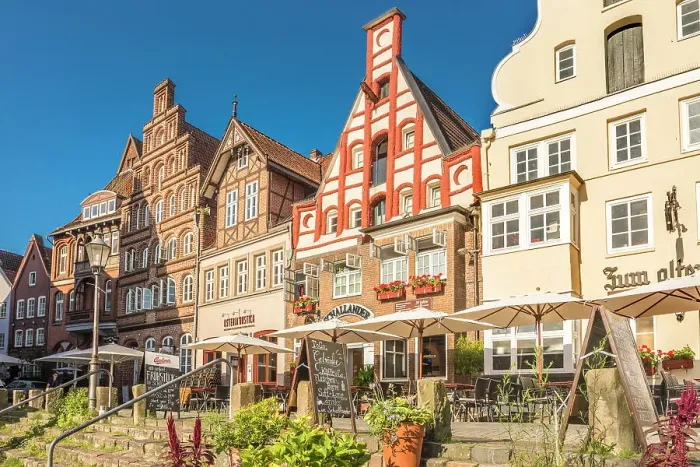 Framed Print : Row of houses at Am Stintmarkt with outdoor terraces, Luneburg, Lower Saxony, Germany Framed Print : Row of houses at Am Stintmarkt with outdoor terraces, Luneburg, Lower Saxony, Germany
