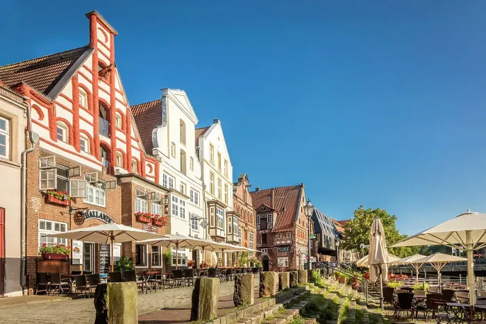Framed Print : Row of houses at Am Stintmarkt with outdoor terraces, Luneburg, Lower Saxony, Germany Framed Print : Row of houses at Am Stintmarkt with outdoor terraces, Luneburg, Lower Saxony, Germany