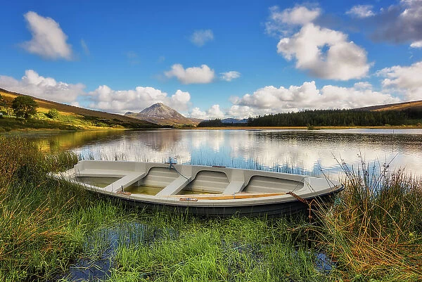 Rowing boat at Lough Dunlewey and Mount Errigal in background, County Donegal, Ulster region, Ireland, Europe