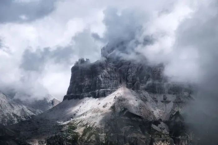 Framed Print : Rugged peaks partly covered in clouds, Dolomites, Italy