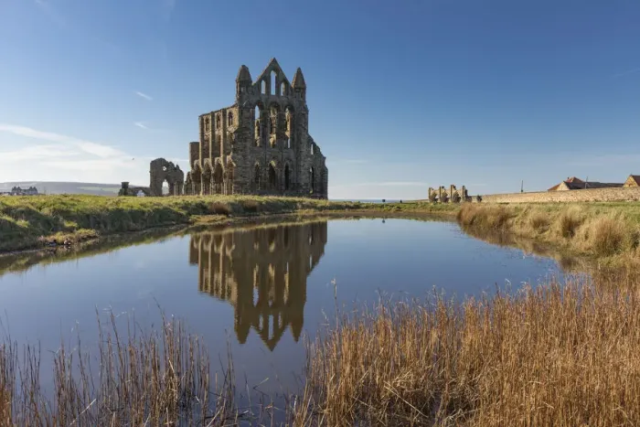 Framed Print : Ruins of Whitby Abbey reflected in a pool, Whitby, North Yorkshire, England, United