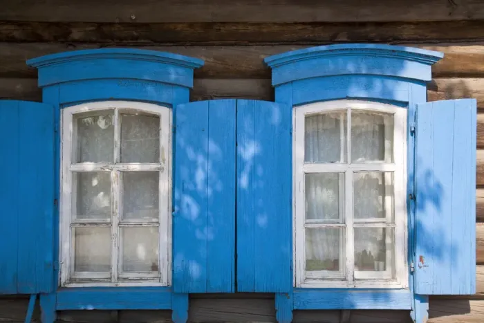 Framed Print : Russia, Irkutsk, Wooden house with blue shuttters
