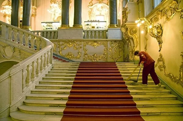 Russia, St. Petersburg; A worker inside the state Hermitage Museum