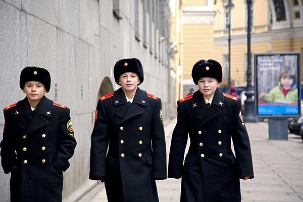 Russia, St. Petersburg; Three young cadets walking in the main streets of the city