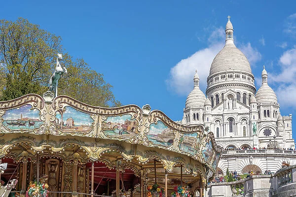 Sacre Coeur, Montmartre, Paris, France. Carousel in foreground