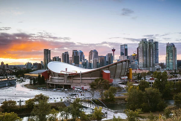 Saddledome stadium and city skyline at sunset, Calgary, Alberta, Canada