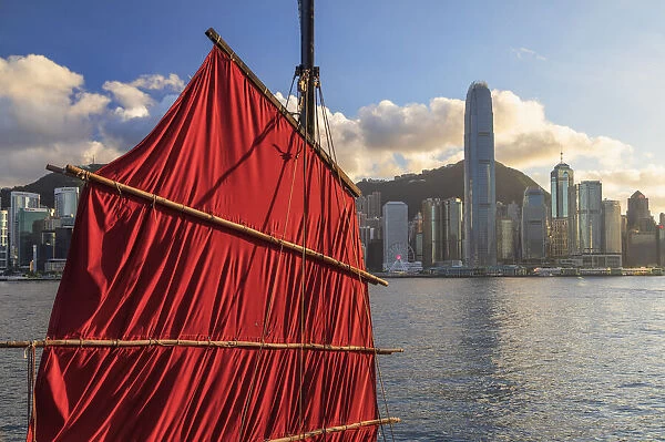 Sail of junk boat and skyline of Hong Kong Island, Hong Kong