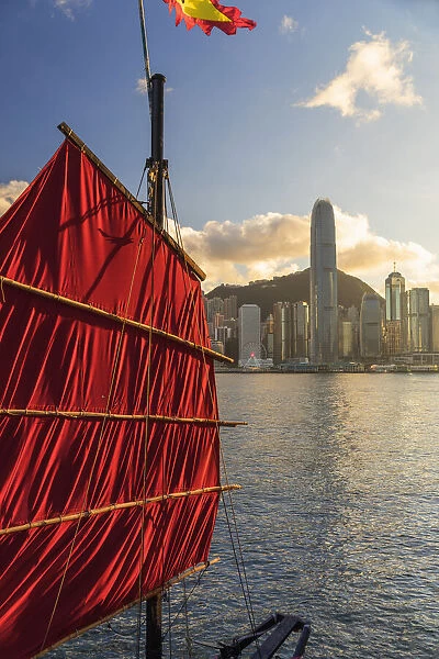 Sail of junk boat and skyline of Hong Kong Island, Hong Kong