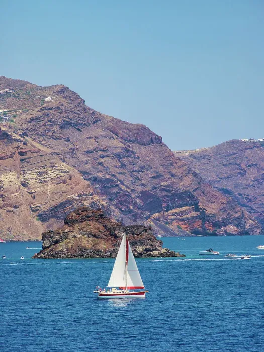 Framed Print : Sailboat at the caldera near Oia Village, Santorini or Thira Island, Cyclades, Greece Framed Print : Sailboat at the caldera near Oia Village, Santorini or Thira Island, Cyclades, Greece