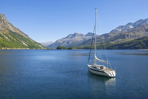 Sailboat on Lake Sils with Corvatsch, Bernina mountain range, Upper Engadin, Grisons (Graubunden), Switzerland