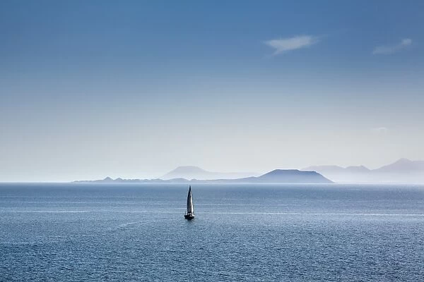 Sailing boat and Fuerteventura, from Playa Blanca, Lanzarote, Canary Islands, Spain