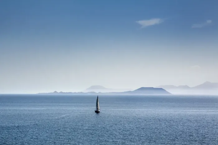 Framed Print : Sailing boat and Fuerteventura, from Playa Blanca, Lanzarote, Canary Islands, Spain Framed Print : Sailing boat and Fuerteventura, from Playa Blanca, Lanzarote, Canary Islands, Spain