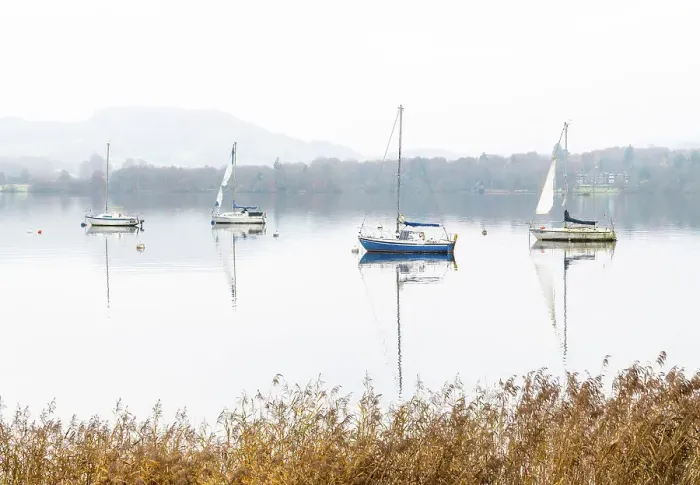 Framed Print : Sailing boats reflected in Windermere on a misty autumnal morning, Lake District National Park, Cumbria, England Framed Print : Sailing boats reflected in Windermere on a misty autumnal morning, Lake District National Park, Cumbria, England