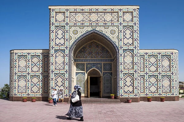 Samarkand, Uzbekistan, Central Asia. A woman walks close to planetarium