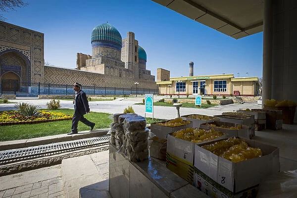 Samarkand, Uzbekistan, Central Asia. A man walks close to grocery market