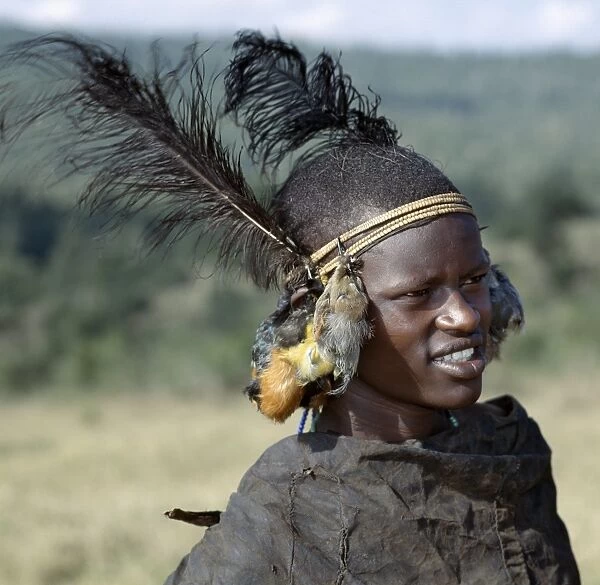 A Samburu initiate with bird skins hanging from his headband