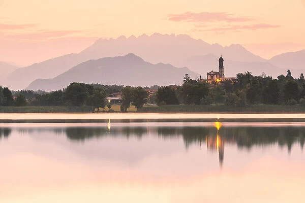 San Giuseppe Church and Bosisio Parini lakefront reflected in the Pusiano lake with