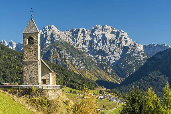 San Leonardo church with the Dolomites in the background, Comelico Superiore, Veneto