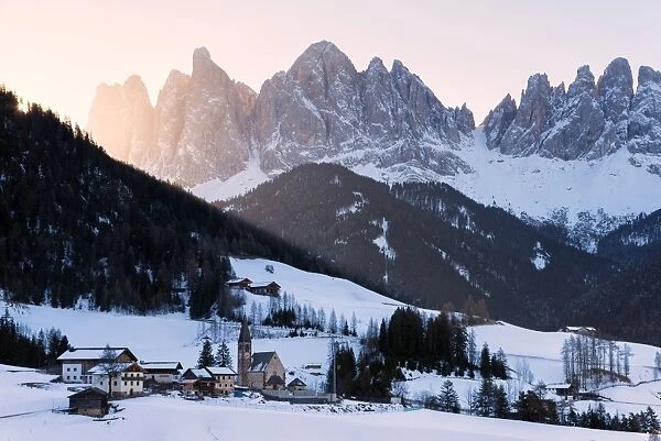 Sankt Magdalena in a winter sunrise in Funes valley, Odle Natural park in Trentino