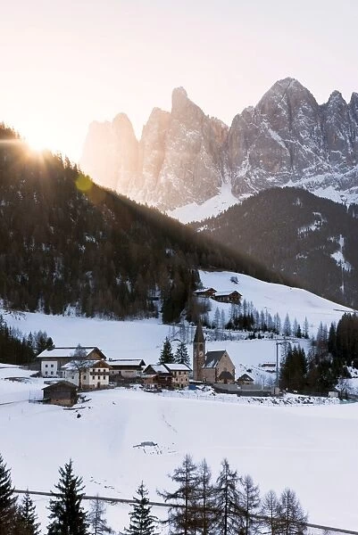 Sankt Magdalena in a winter sunrise in Funes valley, Odle Natural park in Trentino