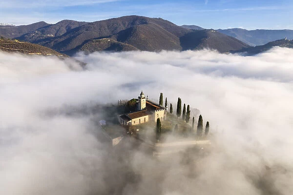 Santissima di Gussago over the clouds in Franciacorta, Brescia province in Lombardy, Italy