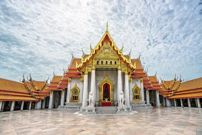 Framed Print : Scenic clouds at dawn over the decorated Wat Benchamabophit temple, (Marble Temple), Bangkok, Thailand Framed Print : Scenic clouds at dawn over the decorated Wat Benchamabophit temple, (Marble Temple), Bangkok, Thailand