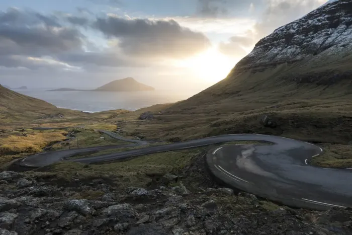 Framed Print : The scenic road for Norðradalur at sunset. The island of Koltur in the background. Faroe Islands