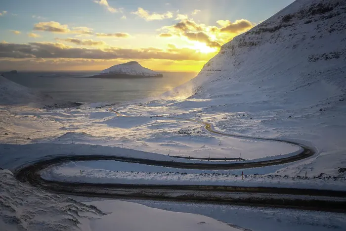 Framed Print : The scenic road in Norðradalur at sunset. Island of Streymoy. In the background the island of Koltur. Faroe Islands Framed Print : The scenic road in Norðradalur at sunset. Island of Streymoy. In the background the island of Koltur. Faroe Islands