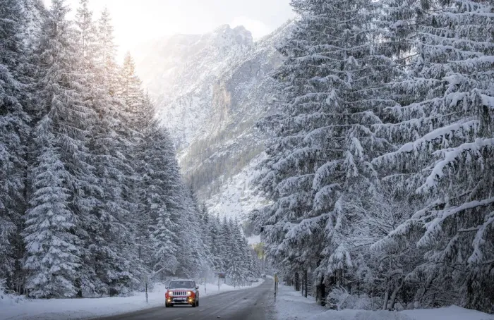 Framed Print : Scenic route with red car and snowy winter landscape, Dolomites Alps, Italy Framed Print : Scenic route with red car and snowy winter landscape, Dolomites Alps, Italy