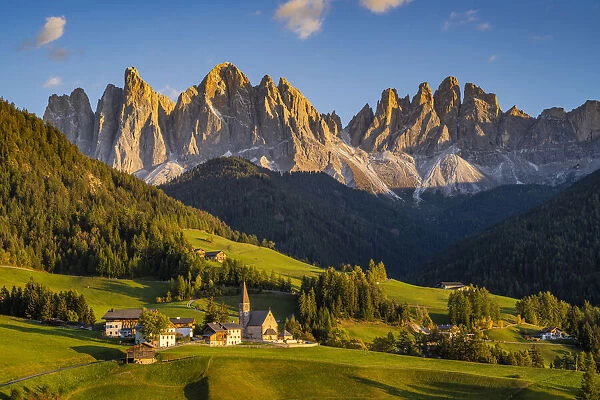 Scenic sunset view over the village of Santa Maddalena with the Odle Dolomites mountain group behind, Funes valley, South Tyrol, Italy