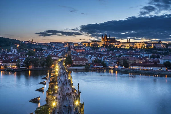 Scenic view of Charles Bridge and Prague Castle at night, Prague, Bohemia, Czech Republic