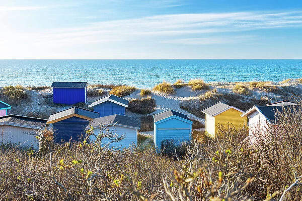 Scenic view of colourful beach huts against blue sky on the beach of Tisvildeleje, Tisvilde, Hovedstaden, Denmark