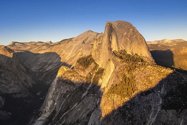 Scenic view of Half Dome granite rock formation at Yosemite National Park during sunset