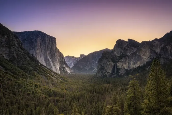 Framed Print : Scenic view of trees by rocky mountains at Tunnel View before sunrise Framed Print : Scenic view of trees by rocky mountains at Tunnel View before sunrise