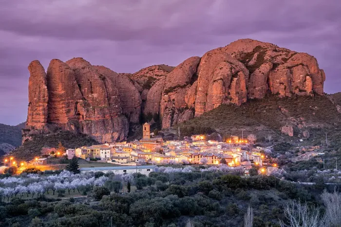 Framed Print : Scenic view of the village with the Mallos de Aguero rock formations behind, Aguero, Huesca, Aragon, Spain Framed Print : Scenic view of the village with the Mallos de Aguero rock formations behind, Aguero, Huesca, Aragon, Spain