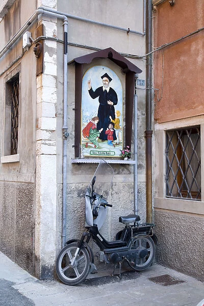 Scooter and relgious wall mural, Chioggia, Venice, Veneto, Italy