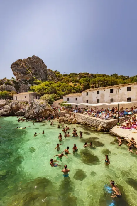 Framed Print : Scopello, Sicily. People taking a bath and sunbathing near the old tonnara Framed Print : Scopello, Sicily. People taking a bath and sunbathing near the old tonnara