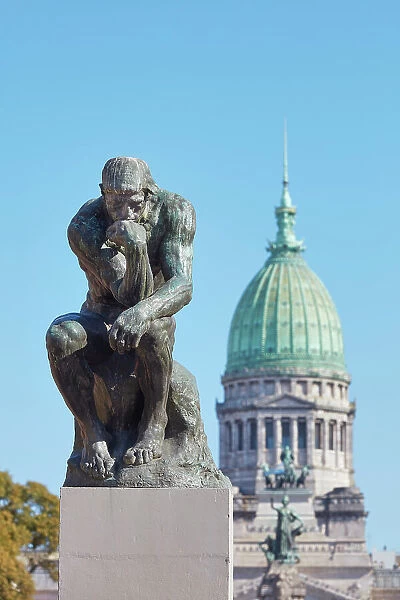 The sculpture of 'The Thinker' (Le Penseur) by French artist Auguste Rodin in front of the Argentine National Congress dome, Monserrat, Buenos Aires, Argentina