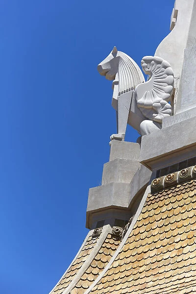 The sculpture of a winged lion on the dome of the historic '