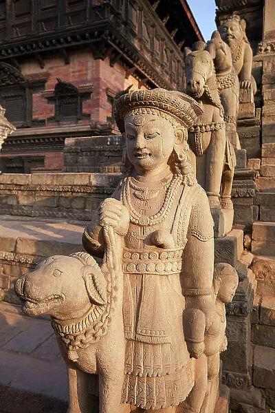 Sculptures in a temple of the Durbar Square of Bhaktapur at sunset, Kathmandu Valley, Nepal