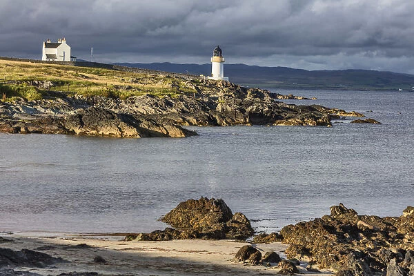Sea coast with lighthouse, Port Charlotte, Islay, Inner Hebrides, Argyll, Scotland, UK