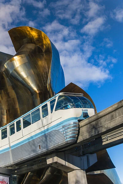 Seattle Center Monorail passing through the Experience Music Project and Science Fiction