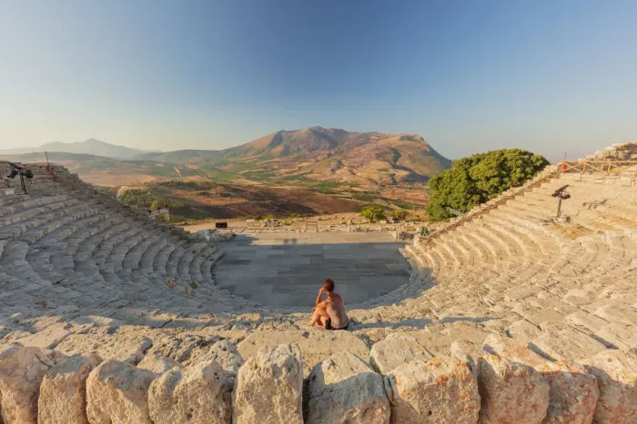 Framed Print : Segesta, Sicily. A woman sitting alone in the greek theater of Segesta at sunset Framed Print : Segesta, Sicily. A woman sitting alone in the greek theater of Segesta at sunset