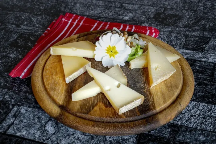 Framed Print : Selection of typical italian cheese in wood chopping board Framed Print : Selection of typical italian cheese in wood chopping board