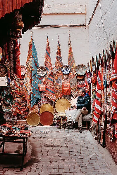 Seller of carpets and fabrics in the souk, Marrakech