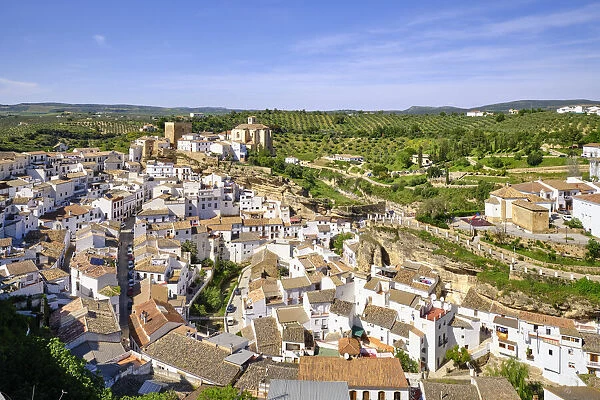 Setenil de las Bodegas with the medieval castle and the church at the hilltop, Andalucia. Spain